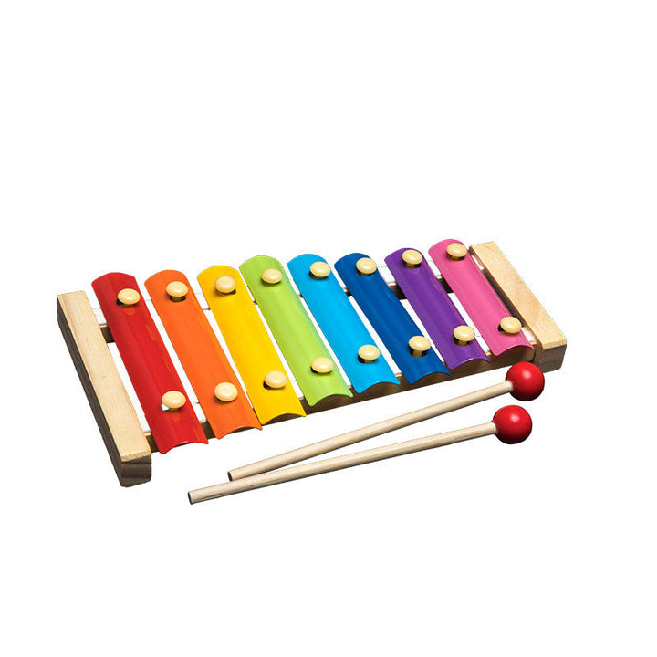 Colorful wooden xylophone with two mallets on a white background.