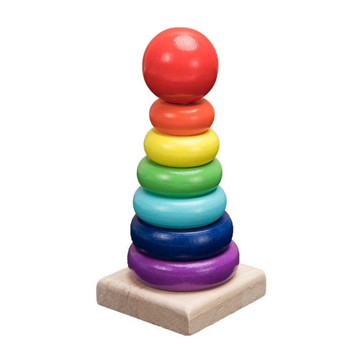 Colorful wooden stacking rings toy on a white background.