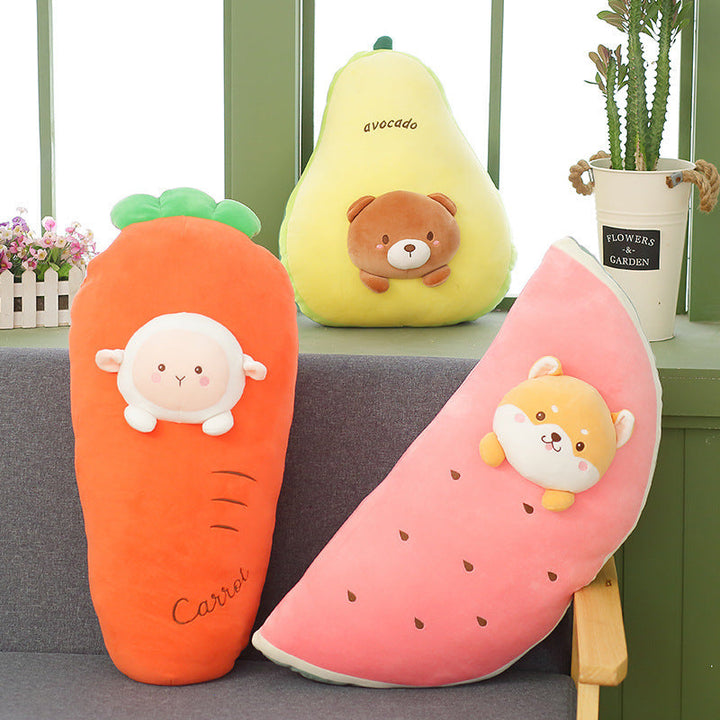 Three plush toys shaped like a carrot, avocado, and watermelon with cute animal faces on a couch.