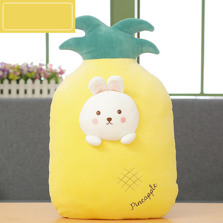 Plush toy shaped like a pineapple with a cute face on a wooden surface.