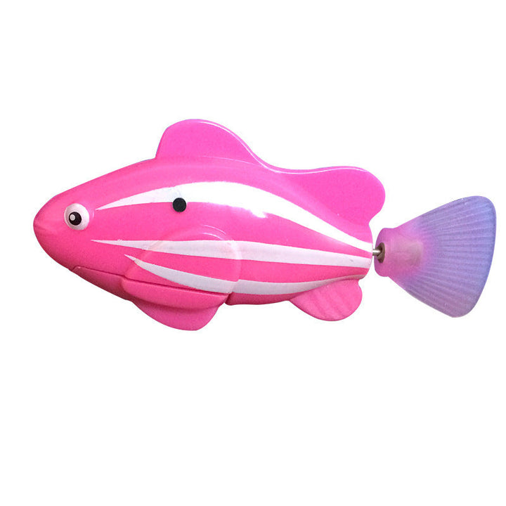Pink toy fish with a shell-like tail on a white background.