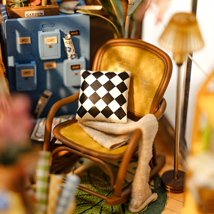Wicker chair with a checkered pillow in a cozy room setting.