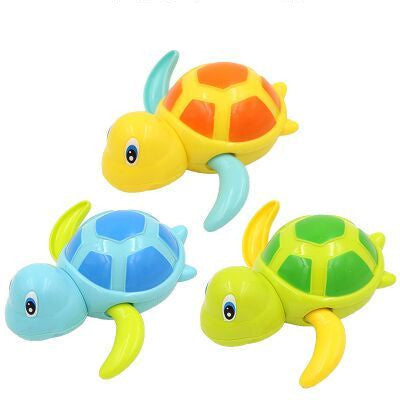Three colorful turtle toys on a white background.