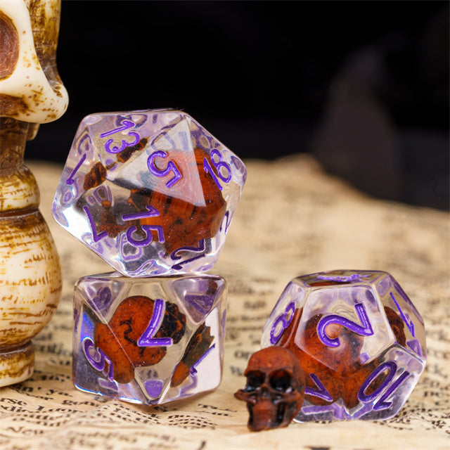 Orange Skull Dice | Clear RPG 7-Dice Set w/ Purple Numbers