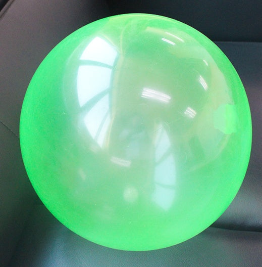 Green glowing ball on a dark background.