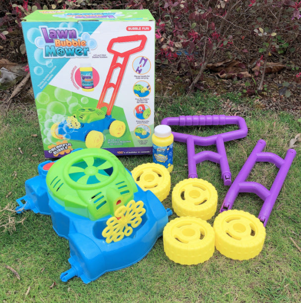 Lawn bubble mower toy set with packaging on grass.