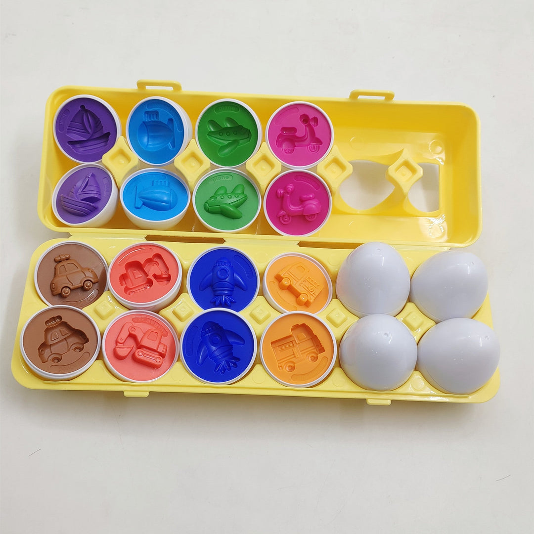 Colorful egg-shaped molds with corresponding stamps on a yellow tray against a white background.