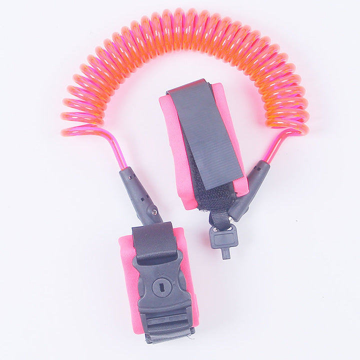 Coiled lanyard with pink and orange spring, attached to gray clips on a white background.