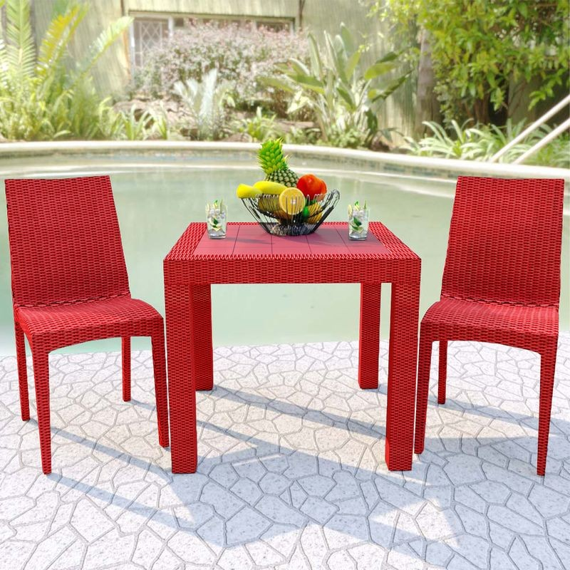 LeisureMod Weave Mace Indoor/Outdoor Dining Chair (Armless) Red at Table.