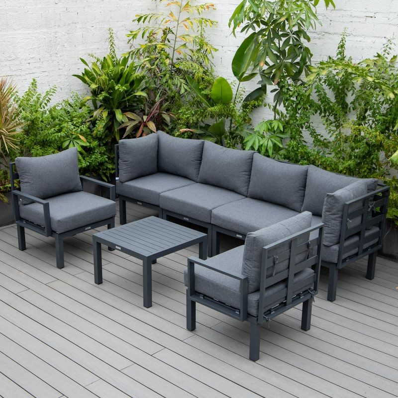 LeisureMod Chelsea 7-Piece Patio Sectional and Coffee Table Set Black Aluminum with Cushions Black