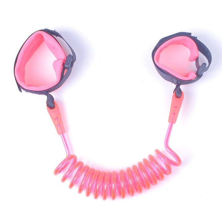 Pink and gray wristband with a coiled leash on a white background.