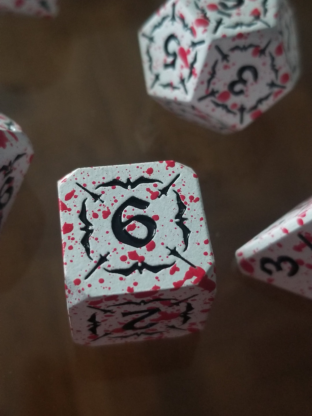Battle Hardened Dice: White metal dice w/Black numbering and Red Splatter 7- Dice Set Rpg