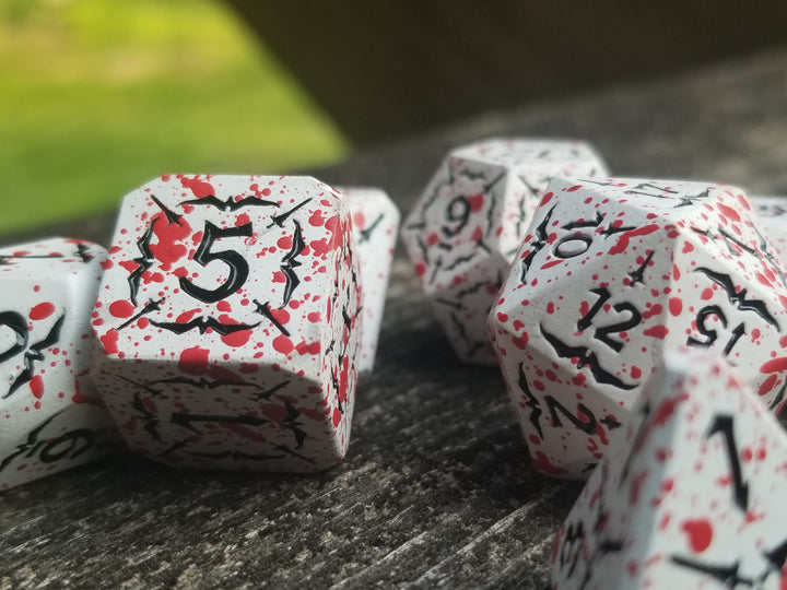 Battle Hardened Dice: White metal dice w/Black numbering and Red Splatter 7- Dice Set Rpg