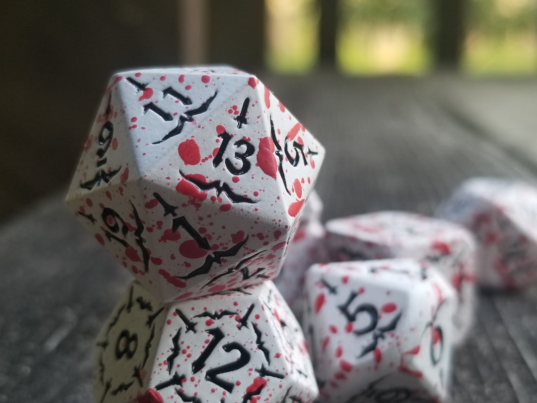 Battle Hardened Dice: White metal dice w/Black numbering and Red Splatter 7- Dice Set Rpg