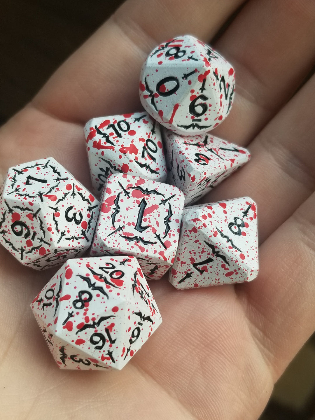 Battle Hardened Dice: White metal dice w/Black numbering and Red Splatter 7- Dice Set Rpg