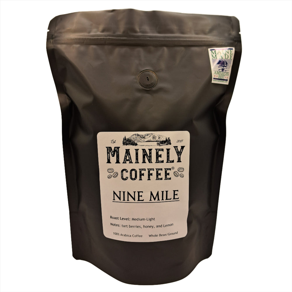 Brown coffee bag with Mainely Coffee Nine Mile label on a white background
