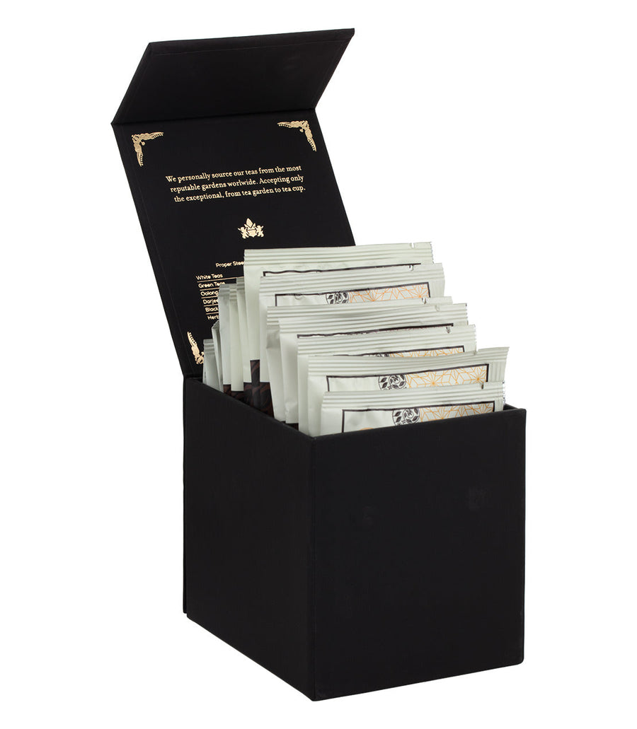 Black box with tea bags inside on a white background.