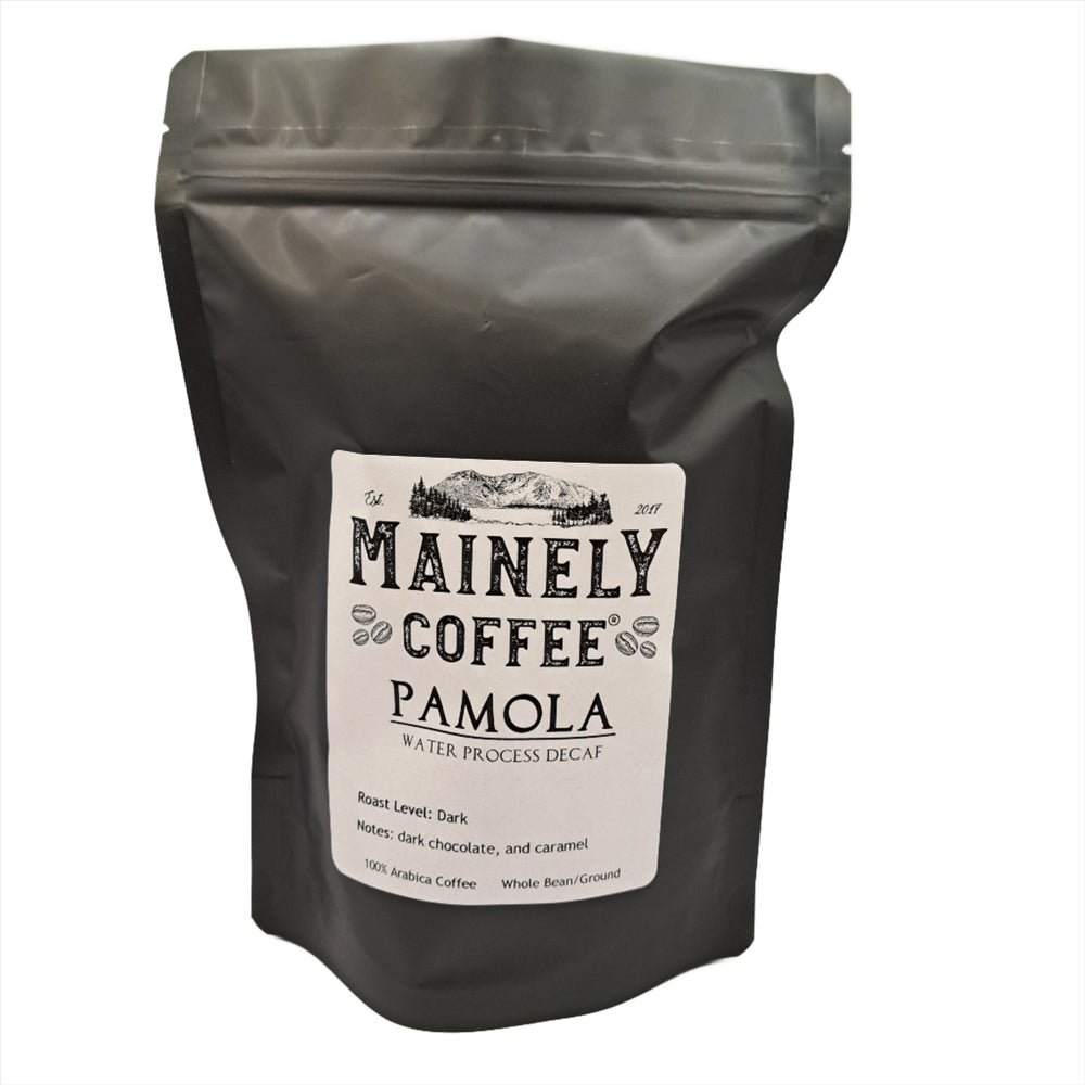 Black coffee bag with Mainely Coffee Pamola label on a white background.