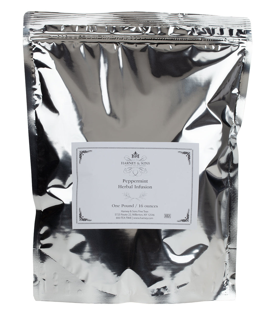 Silver foil packaging of peppermint herbal infusion with a label on a white background.