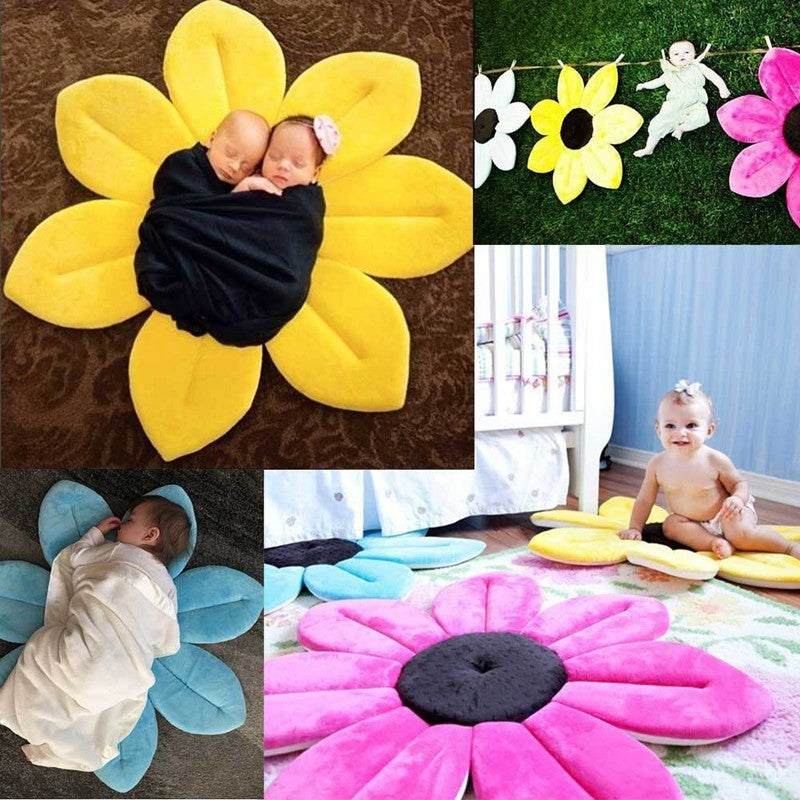 Collage of flower shaped mats in various colors with babies on them.