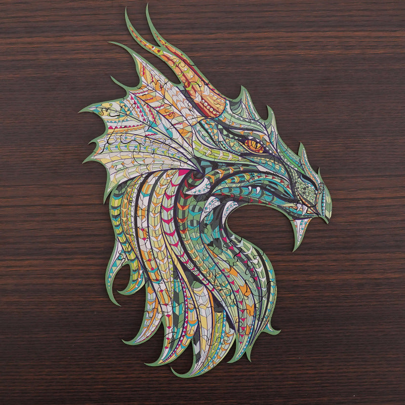 Colorful dragon head design on a wooden background.