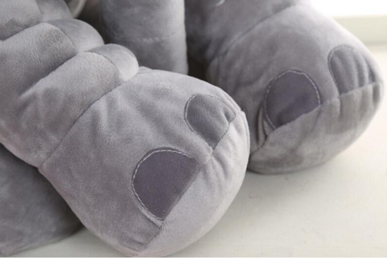 Gray neck elephant with heart designs on a light background.
