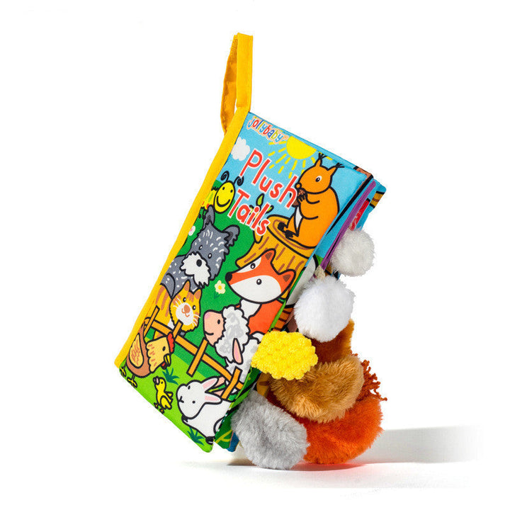 Children's book with plush tails on a white background.