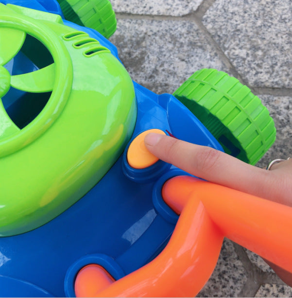 Colorful toy with a hand pressing an orange button on a stone surface.