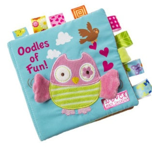 Children's soft book with owl design and colorful text on a blue background.