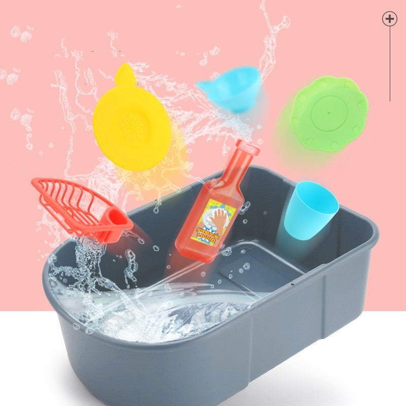 Toy bathtub set with colorful tools on a pink background.