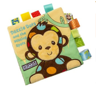 Children's soft book with monkey illustration on a white background.