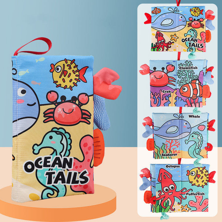 Colorful soft book with ocean-themed illustrations on a stand against a blue background.