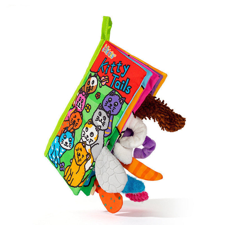 Colorful children's book with plush toys on a white background.