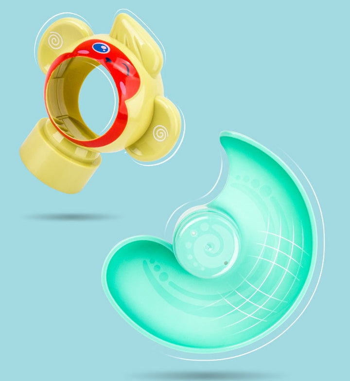 Toy with a yellow base, red ring, and green arch on a light blue background.