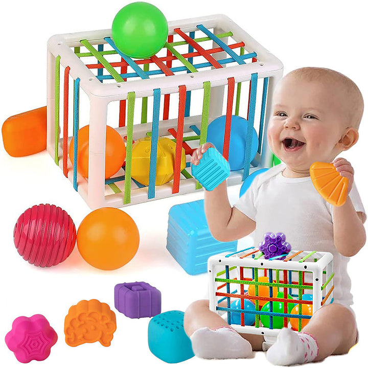 Baby playing with colorful educational toys on a white background.