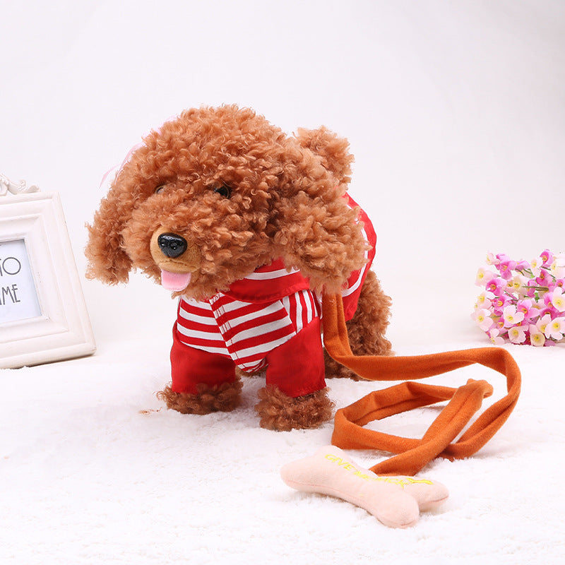 Stuffed dog toy with a leash on a white surface.