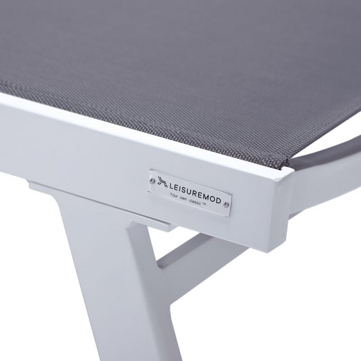 LeisureMod Marlin Patio Chaise Lounge Chair with Armrests in White Aluminum Frame, Set of 2 in Dark Grey Closeup.