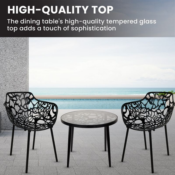 Dining table with high-quality tempered glass top and decorative chairs by a poolside.