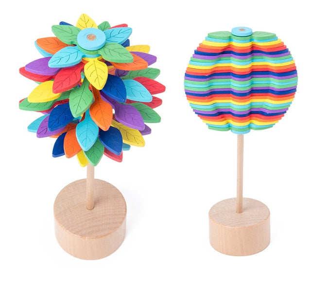 Two colorful wooden toys on stands against a white background.