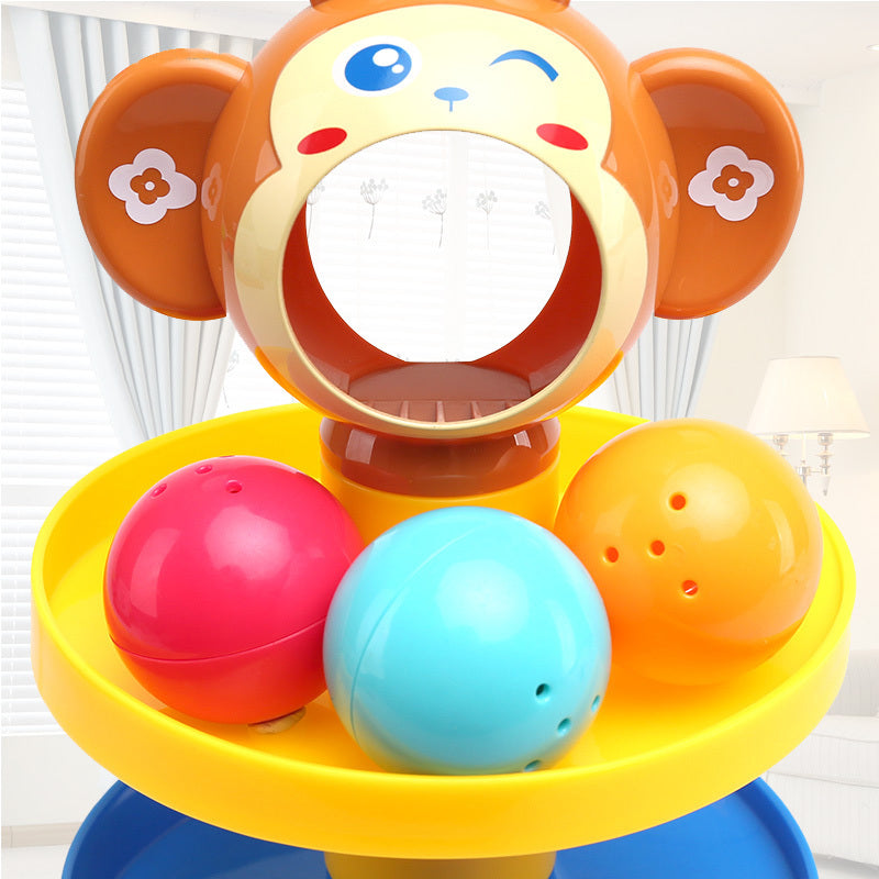 Colorful monkey-shaped toy with three balls on a yellow platform.
