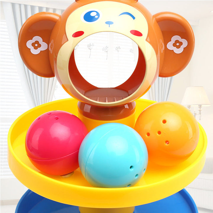 Colorful monkey-shaped toy with three balls on a yellow platform.