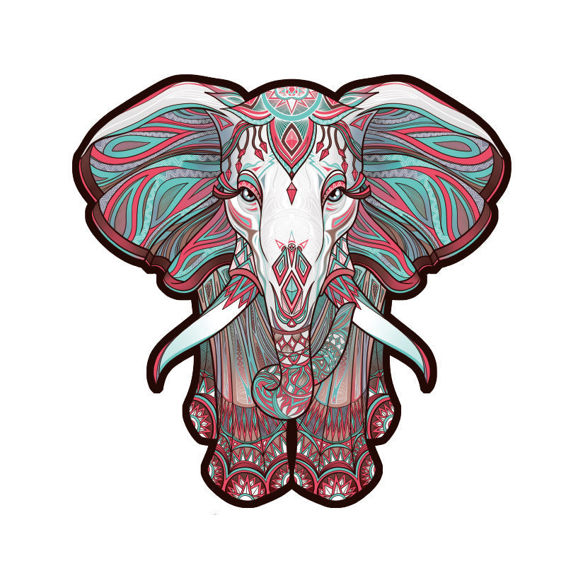 Decorative elephant head with intricate patterns on a white background.