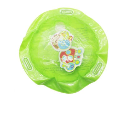Green baby seat with colorful design on a white background.