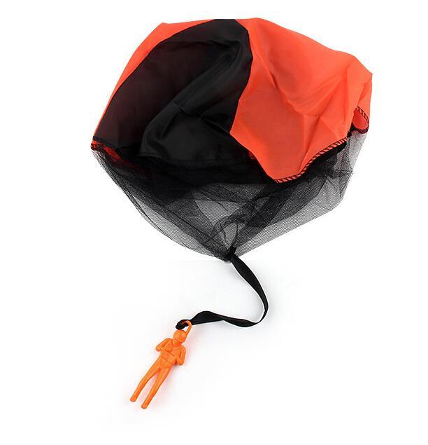 Orange and black parachute with drawstring on a white background.