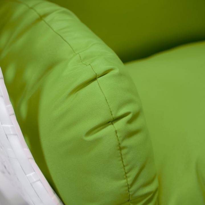 LeisureMod White Wicker Hanging Egg Swing Chair Light Green Cushion Closeup.
