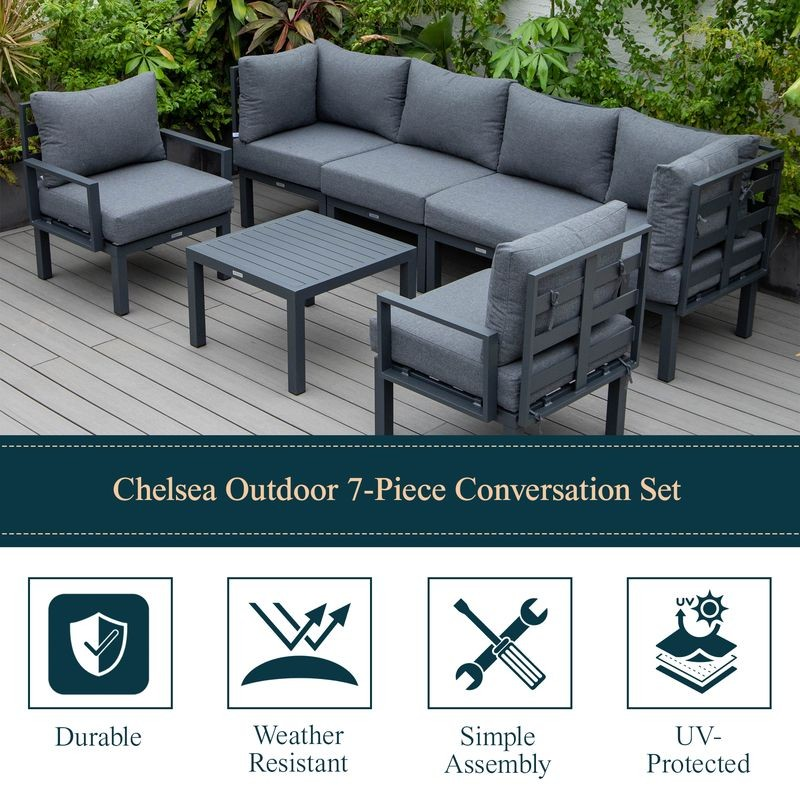 LeisureMod Chelsea 7-Piece Patio Sectional and Coffee Table Set Black Aluminum with Cushions Black Details.
