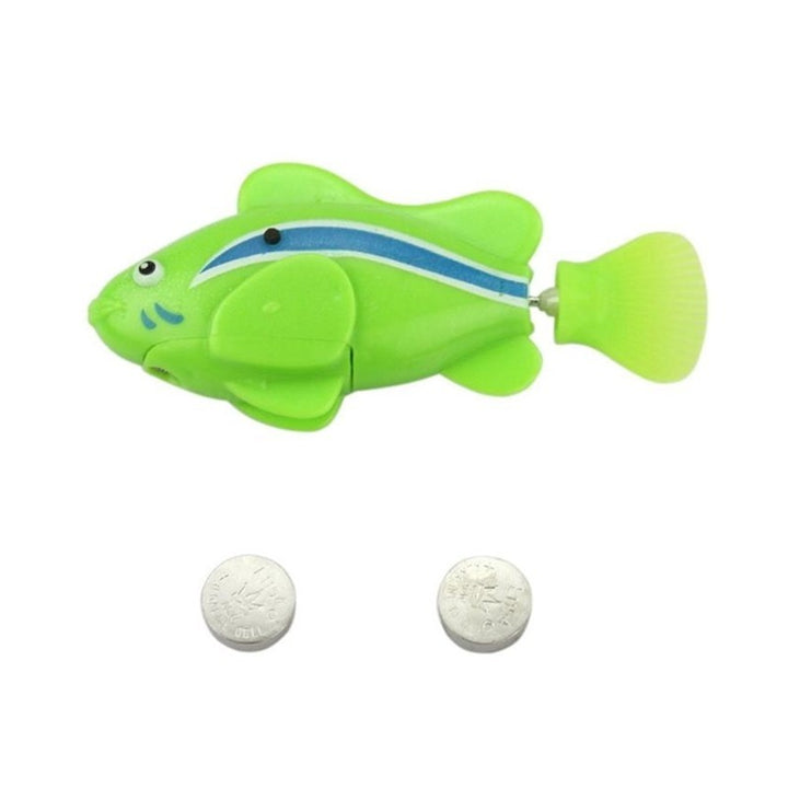 Toy fish with two white tablets on a white background.