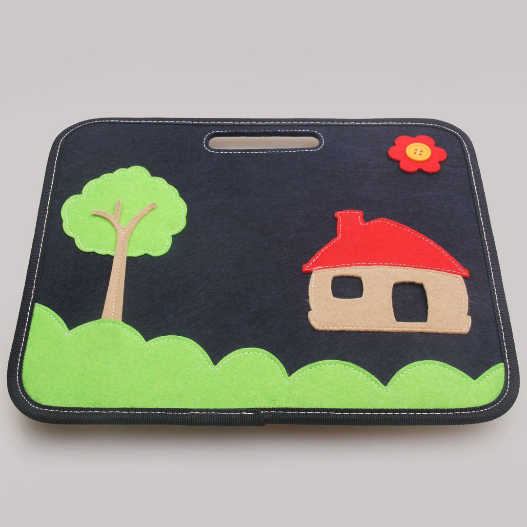 Car seat cover with a house and tree design on a gray background.
