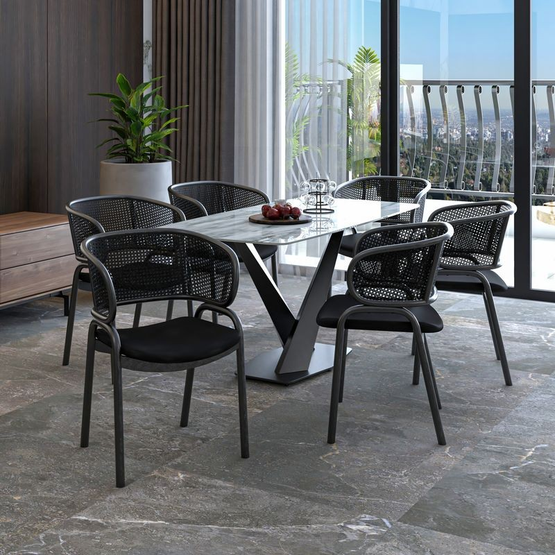 LeisureMod Ervilla Dining Armchair in Black Steel Frame with Black Wicker Back and Black Seat at Table.