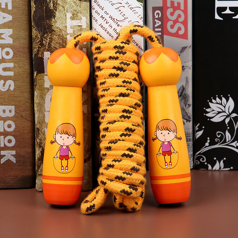 Children's jump rope with cartoon design on handles against a bookshelf background.
